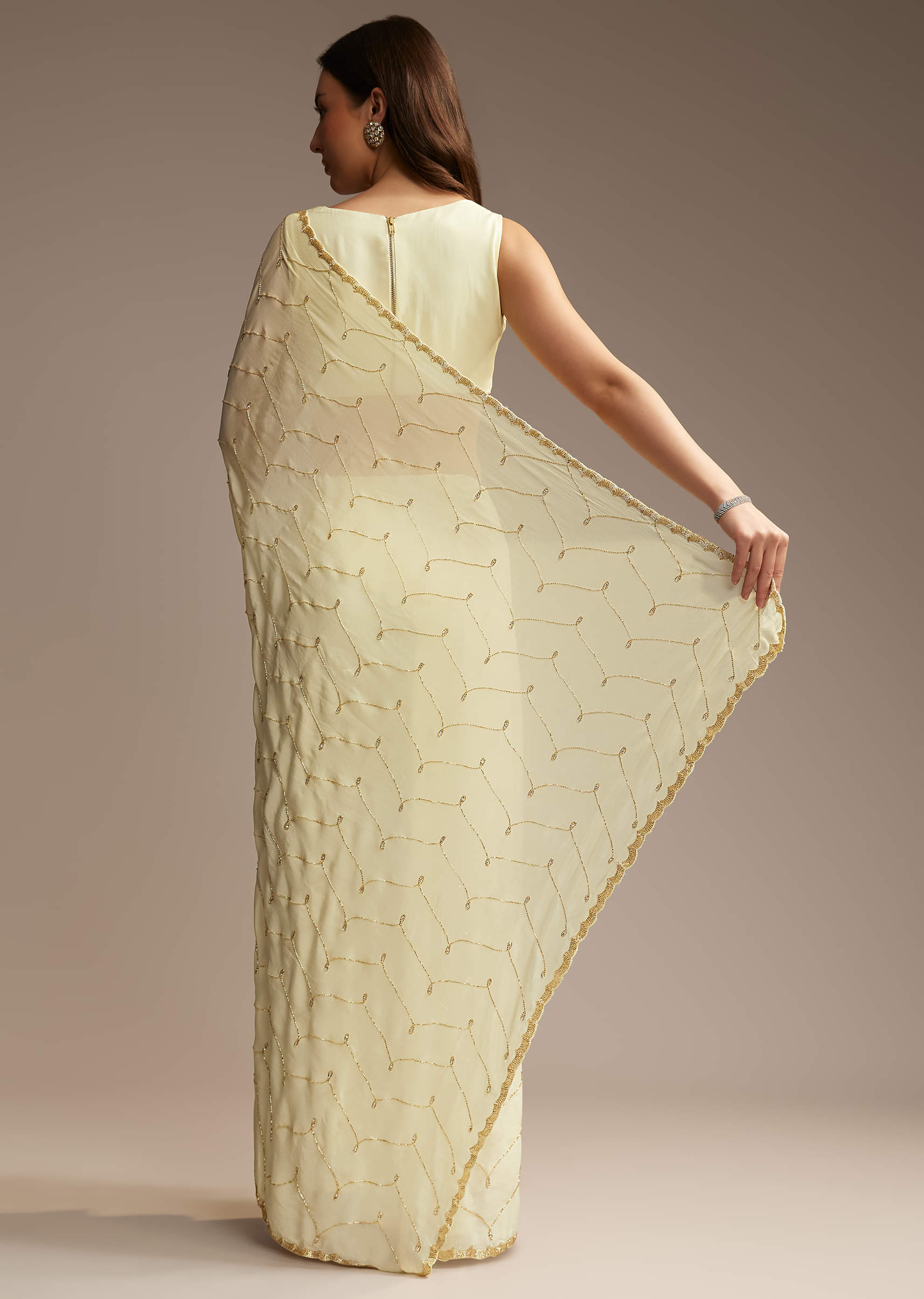 Off White Chinon Saree with Cutdana and Stone Work