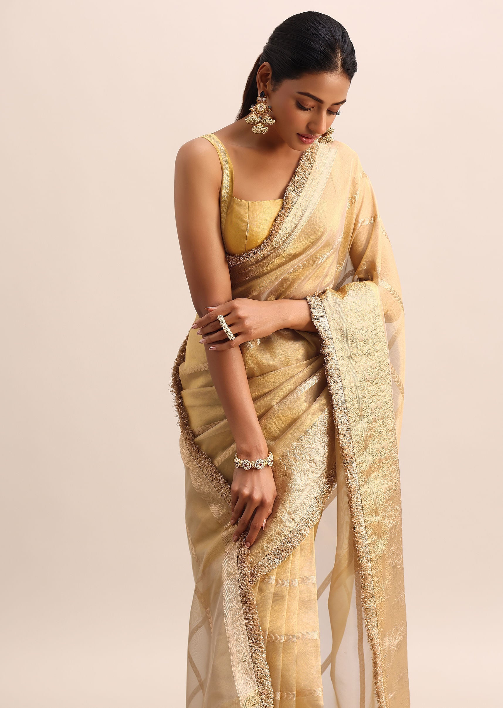 Gold Silk Saree With Zari Woven Border And Zari Frill With Unstitched Blouse