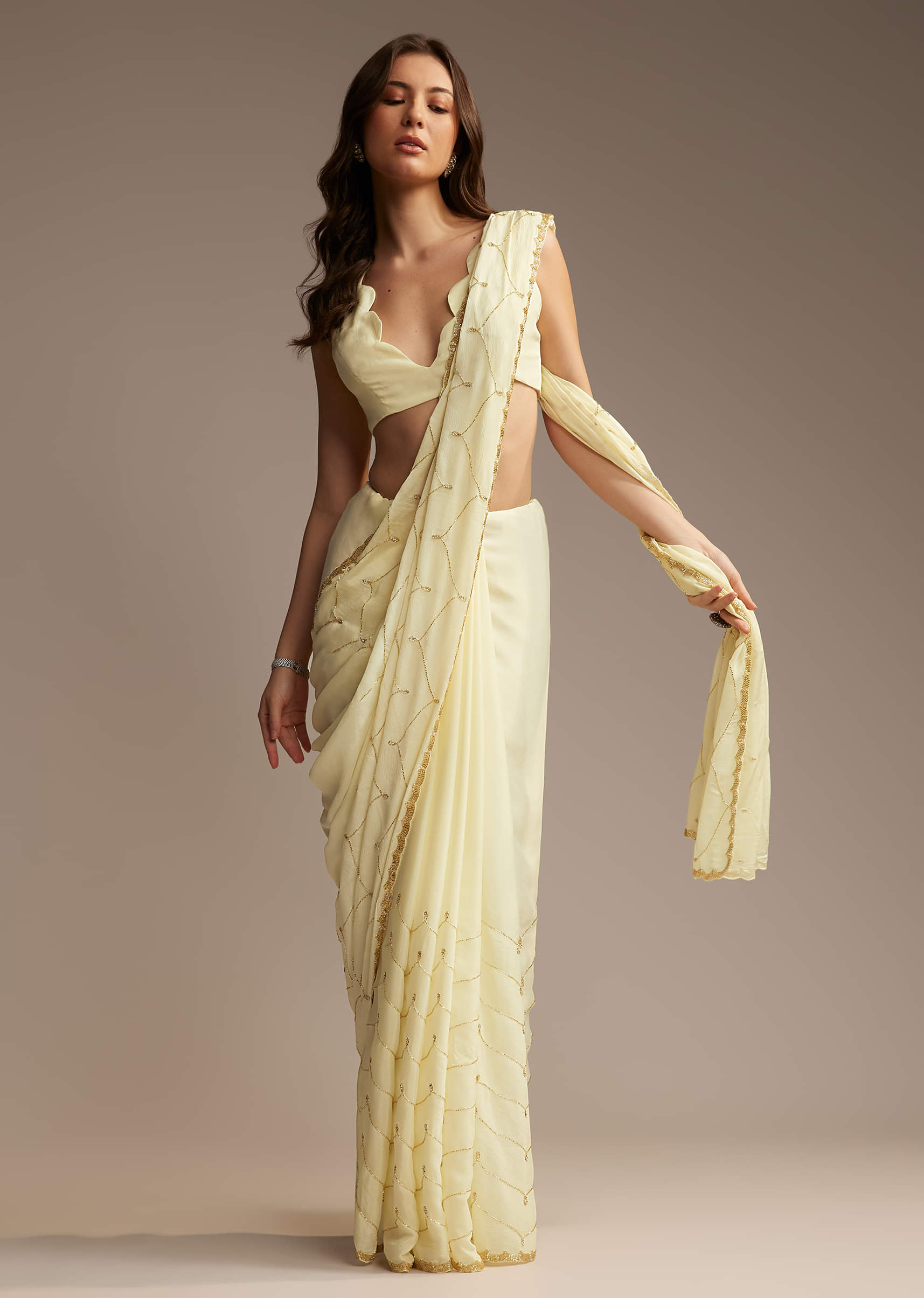 Off White Chinon Saree with Cutdana and Stone Work