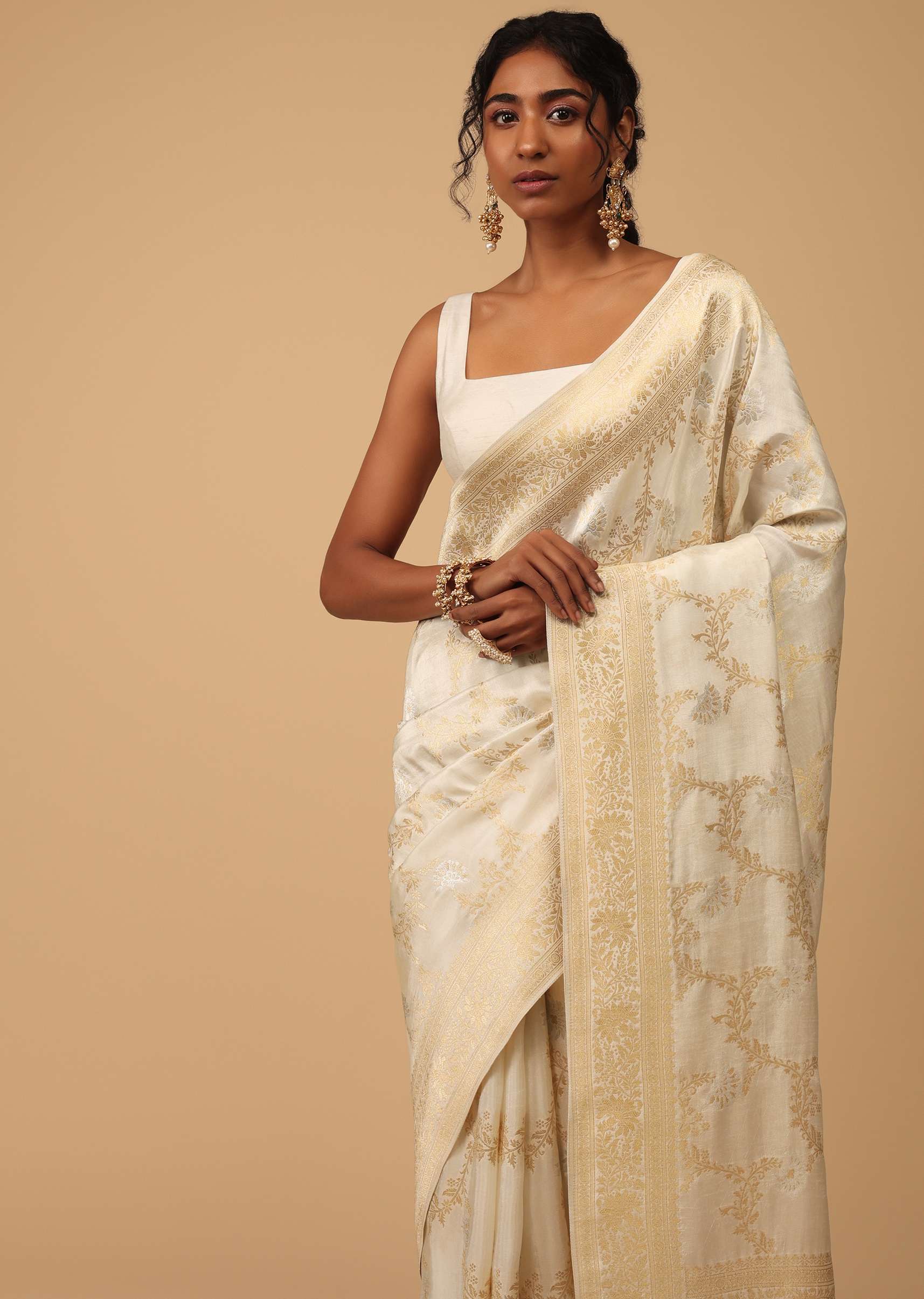 Ivory White Dola Silk Saree With Silver And Gold Jaal Embroidery In Floral Pattern