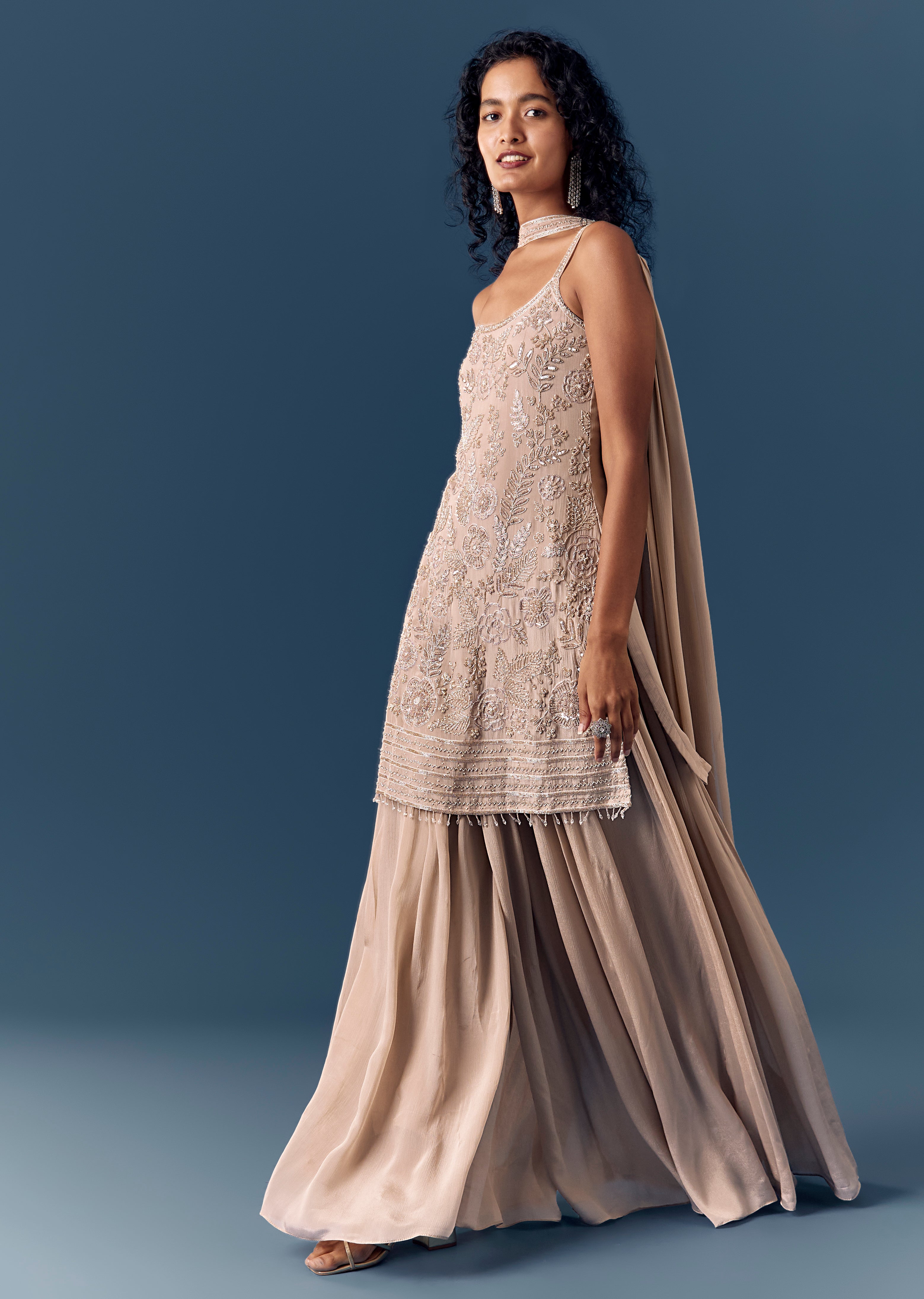 Soft Shimmer Pastel Couple Set – Beige Sequinned Sleeveless Kurta Palazzo Set with Dupatta for Her And Lilac Embellished Rawsilk Kurta Set for Him