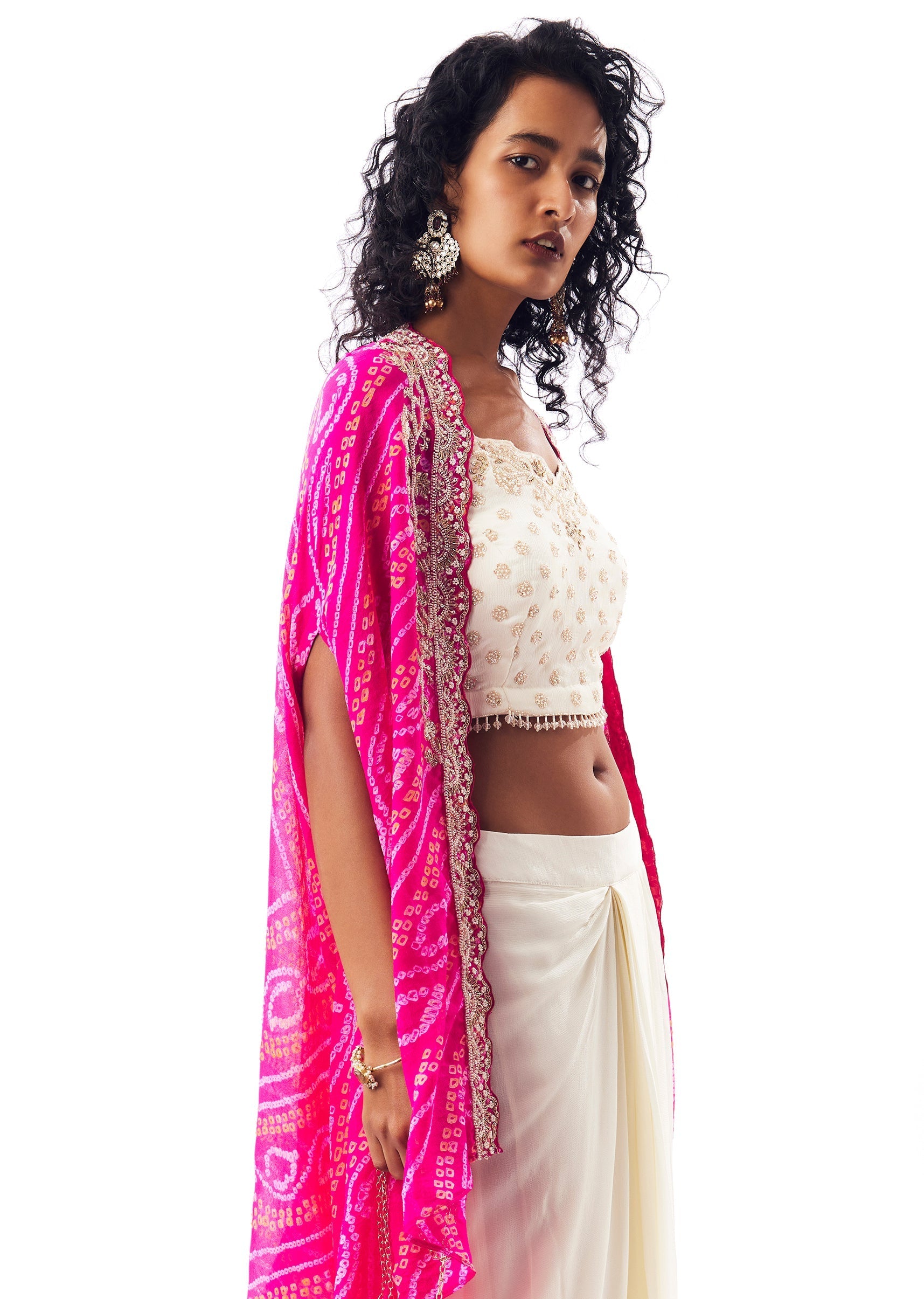 Vibrant Bandhani Festive Couple Set – Bandhani Cape Skirt Set For Her And Pink Silk Tie-Dye Kurta Jacket Set For Him